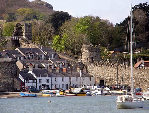 View across the harbour to our cottage, which is next to the old town walls